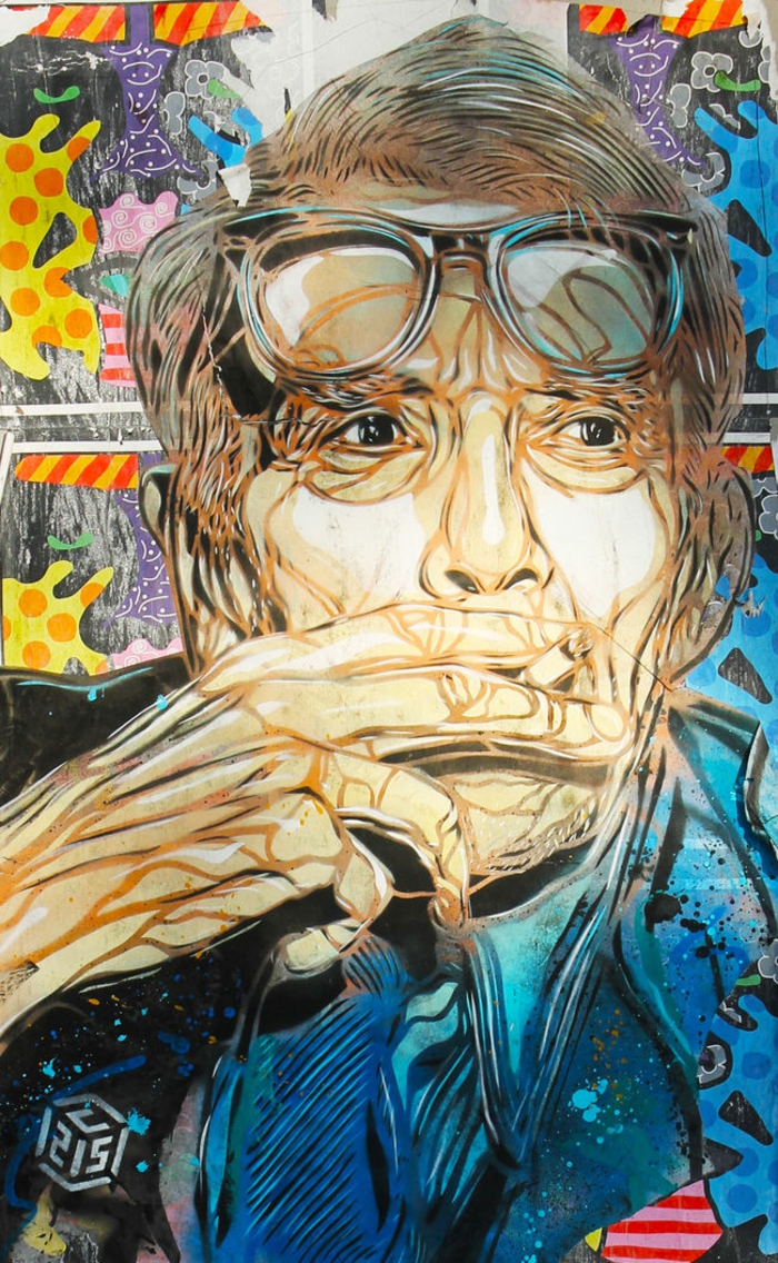 Graffiti-technique-pochoir-street-art-C215-portrait-homme-lunettes