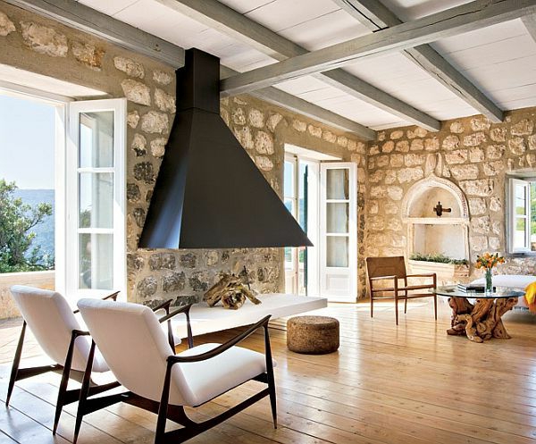 pierre-naturelle-pour-l'intérieur-un-foyer-suspendu-table-bois-flotté-et-verre-murs-en-pierre-naturelle