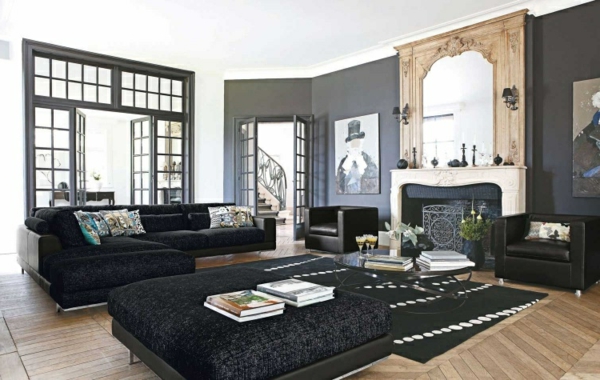 salon-roche-bobois-sofas-noirs-plancher-en-bois