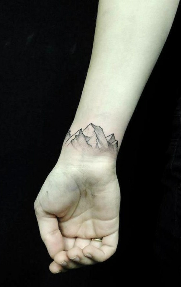 tatouage-aine-hene-idée-créative-moderne-montagnes-main