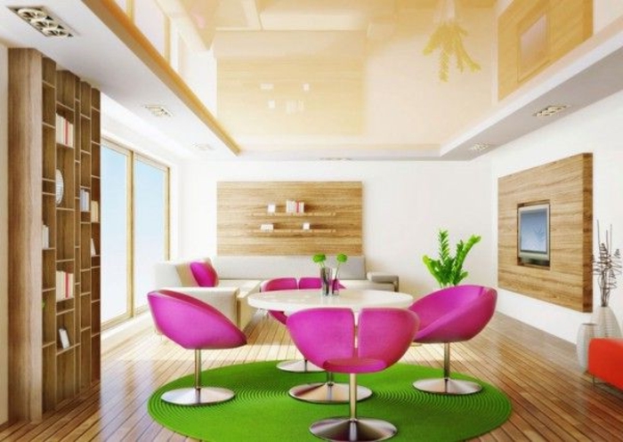 0-suspente-faux-plafond-tapis-rond-vert-chaises-roses-parquette-en-bois-clair-meubles-clairs-d-intérieur