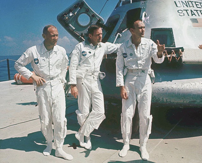 FILE - In this 1969 file photo, Apollo 11 astronauts stand next to their spacecraft in 1969, from left: Col. Edwin E. Aldrin, lunar module pilot; Neil Armstrong, flight commander; and Lt. Michael Collins, command module pilot. (AP Photo, file)