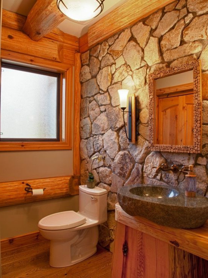 salle-de-bain-avec-mur-en-pierre-de-parement-intérieur-gris-et-vasque-gris-avec-un-miroir