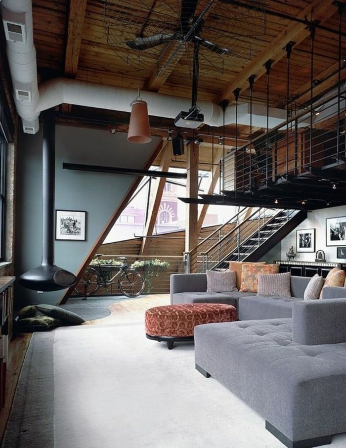1-loft-et-associé-salon-style-industriel-avec-meubles-gris-et-moquette-beige-dans-le-salon-moderne