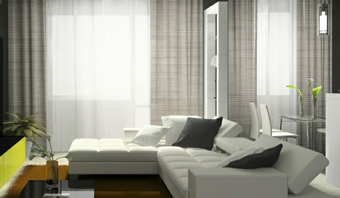 salon-bien-aménagé-double-rideaux-design-canapé-d-angle-blanc