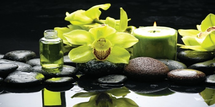 Oriental spa with orchid , candle and pebbles