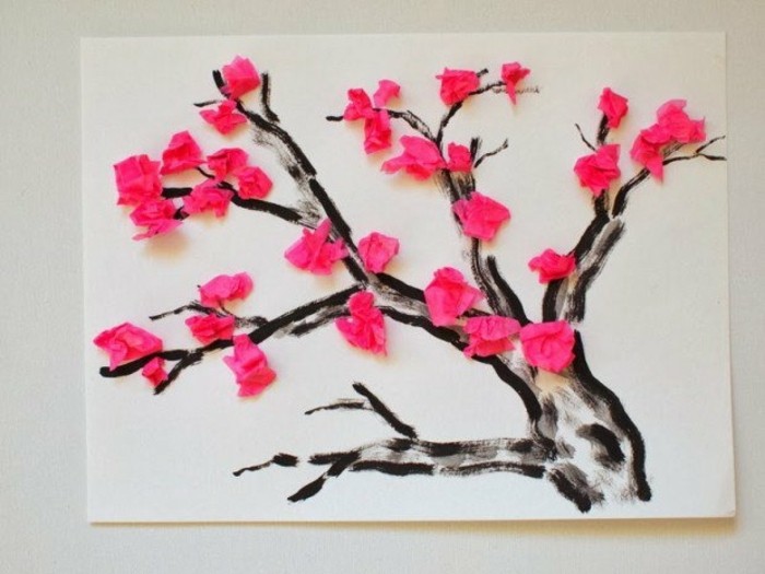 une-peinture-branche-d-arbre-marron-décorée-de-fleurs-rose-en-crépon-exemple-d-activité-manuelle-primaire-diy