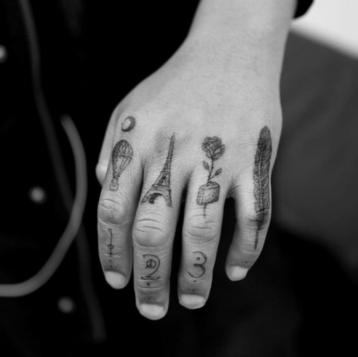 un tatouage différent sur chaque doigt, un tatouage main homme éclectique