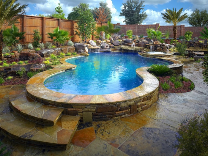 piscine surélevée, jardin tropical, palmier, piscine en pierre, cascades d'eau, plantes vertes