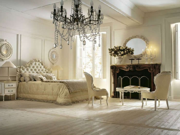 chambre boudoir, murs blanc, tête de lit capitonnée, lampe de chevet blanche, parquet stratifié