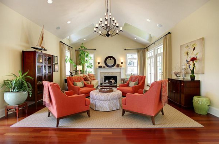 fauteuils couleur corail, salle de séjour élégante, table pouf rond, murs beiges