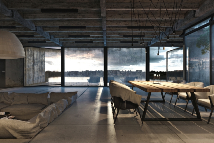 table basse industrielle, lampe suspendue à motif origami, deco industrielle, vue sur la nature, transats bleus, plafond avec poutres