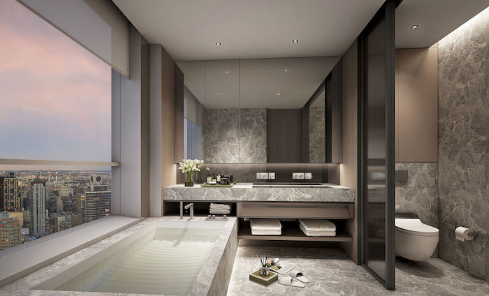 meubles salle de bain, dallage gris effet marbre, baignoire long, comptoir gris, serviette blanche