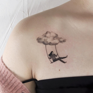 tatouage nuage reverie fille balancoire tete dans le ciel