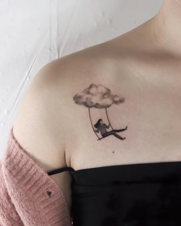 tatouage nuage reverie fille balancoire tete dans le ciel