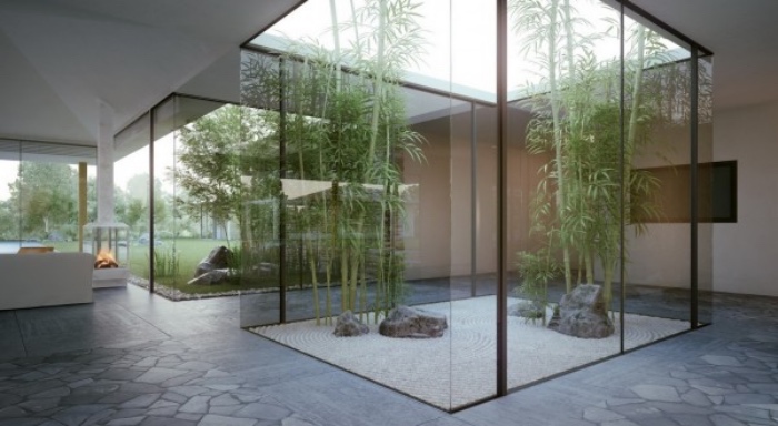 amenagement interieur, une sorte d aquarium, parois en verre, gravier, pierres et bambou à l interieur d une maison moderne, decoration zen