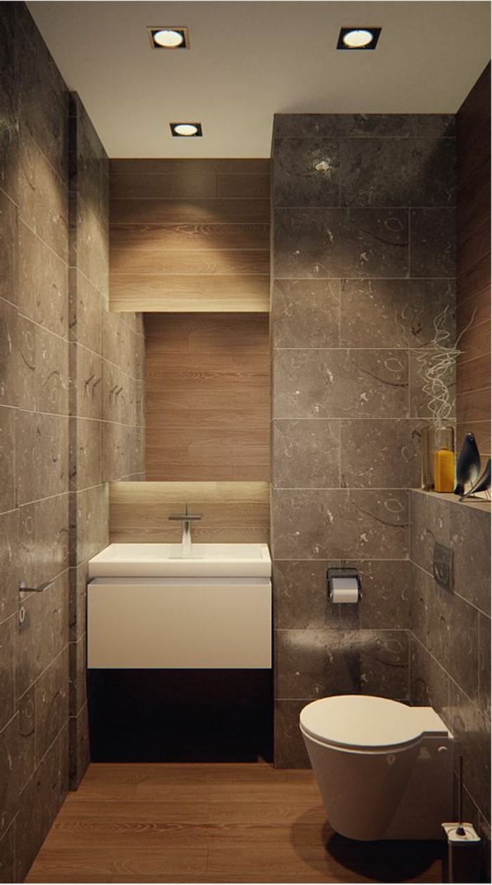 petit salle de bain au revetement type granit avec grand lavabo moderne et meuble WC en forme conique