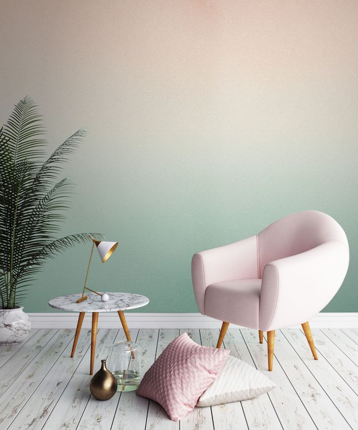 idée peinture salon, atmosphère exotique avec murs en vert et plante tropicale, coussins décoratifs en blanc et rose