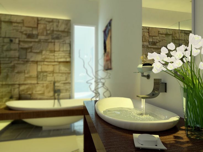 salle de bain cocooning, vasque à poser blanche, décoration avec orchidée, parement pierre naturelle, baignoire moderne