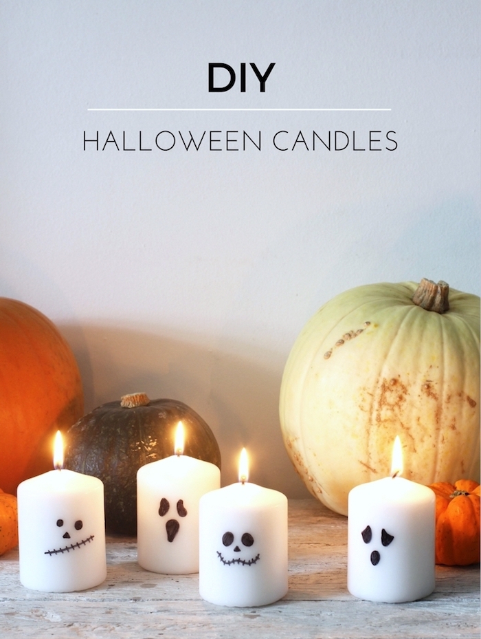 activite manuelle halloween avec des bougies à silhouette bouche et des yeux noirs, fond decoration de citrouilles