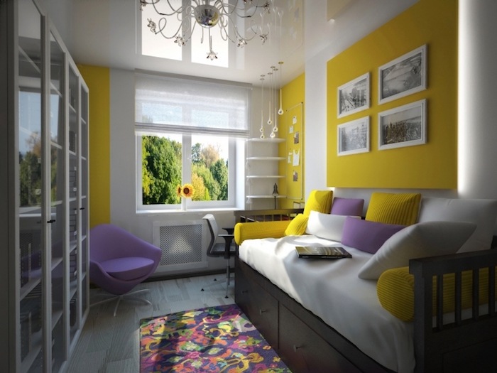 chambre ado, tapis multicolore à motifs floraux, lit en bois peint noir, coussins décoratifs en blanc et violet