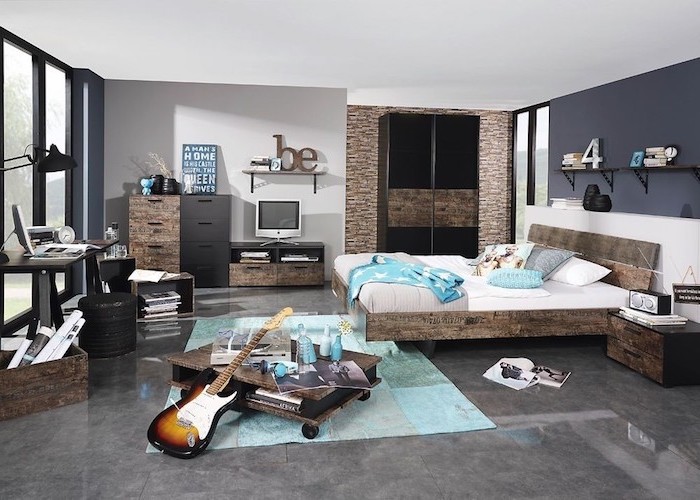 meuble chambre enfant, carrelage de sol à motif marbre gris, revêtement de mur en pierre avec garde-robe noire