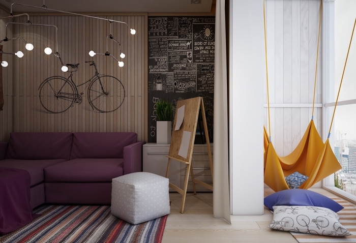 amenagement petite chambre enfant, revêtement de mur en bois clair avec sticker murale noir à design vélo