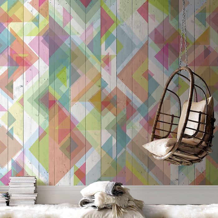 papier peint tendance, formes géométriques colorées, balançoire en bois suspendue, tapis blanc, pile de magazines