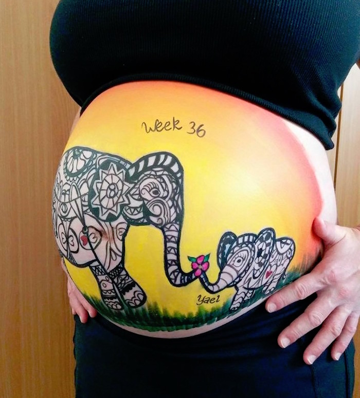 peinture corporelle sur ventre femme enceinte