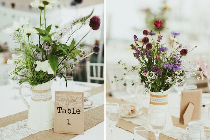 broc blanc transformé en vase de fleurs avec bouquet de fleurs champetre dedans, chiffre table sur papier kraft avec decoration de dentelle