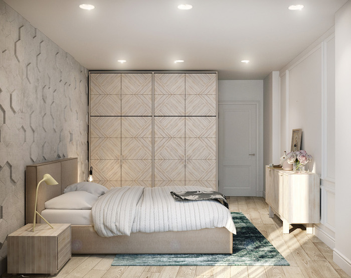 chambre gris et blanc avec des accents beiges, lit, commode et table de nuit bois, parquet clair, tapis bleu vert
