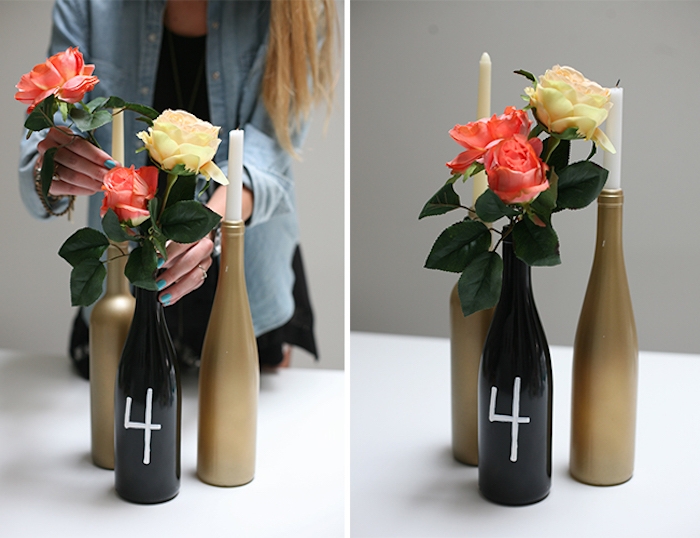 centre de table mariage champetre chic en bouteille repeintes en or et noir avec des bougies et roses