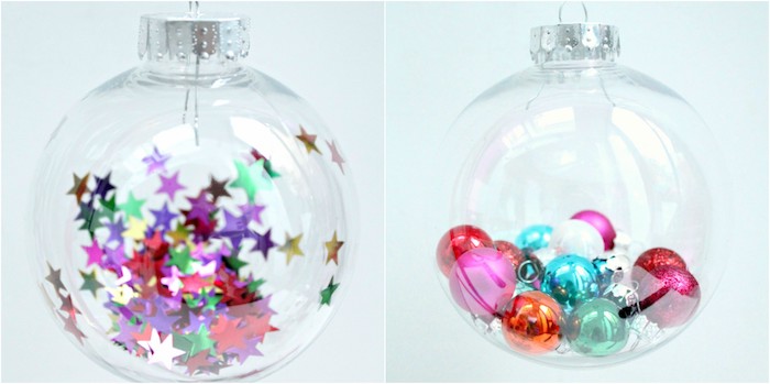décoration sapin de noel dans une boule transparente en plastique avec des étoiles et petites boules colorées à l interieur