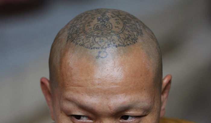 tatouage symbole bouddhiste moine tibetain
