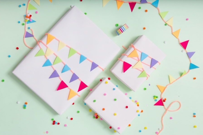 bricolage enfant, emballage boîte cadeau fait main avec feuilles de papier multicolore coupées en triangles