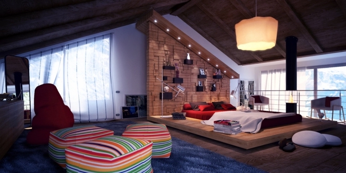 piece mansardée, transformation du grenier en chambre à coucher moderne avec grande fenêtre et meubles rouges