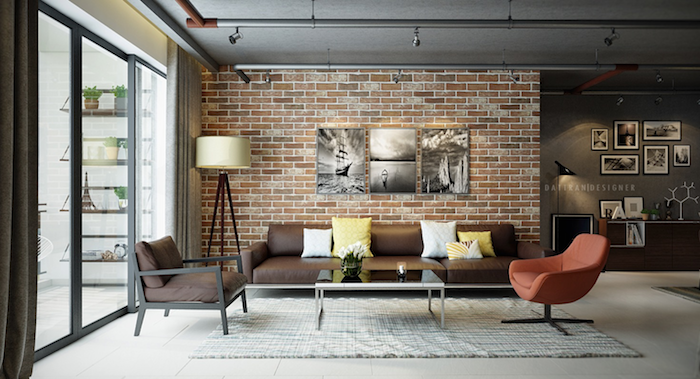 exemple de salon style industriel avec mur en briques, canapé en cuir, tapis gris, fauteuil rouge, deco murale de tableaux noir et blanc, spots