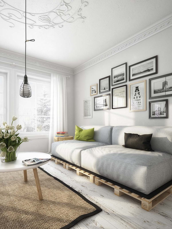 salon moderne en gris et blanc de style scandinave au design épuré avec un canapé en palette