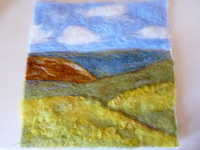 peinture en laine faite avec aiguille à feutrer, un paysage de nature