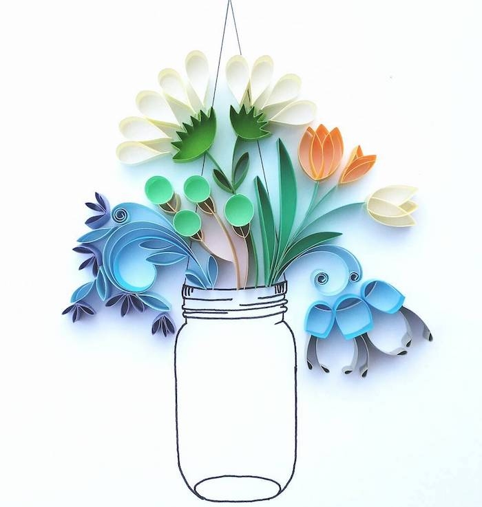 diy fleur en papier, plusieurs fleurs fabriquées grâce à la technique du quilling ou paperolles, bouquet dans un vase dessiné sur un bout de papier