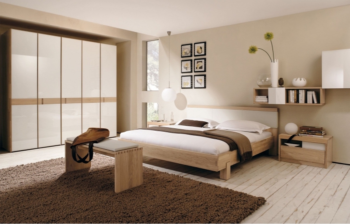 chambre design décorée en couleurs neutres et meubles de bois clair, modèle de garde robe blanche et bois