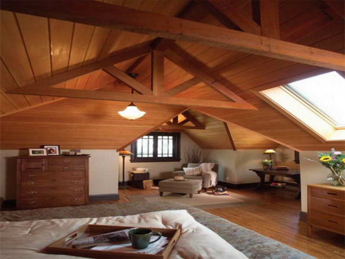intérieur chaleureux style chalet, buffet en bois, sofa et tabouret beige, séjour cosy et authentique