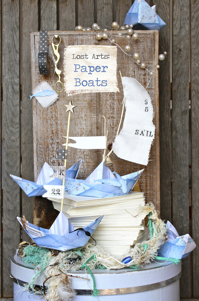 déco origami thématique pour un anniversaire ou un baby-shower marin avec de petits bateaux origami en bleu ciel