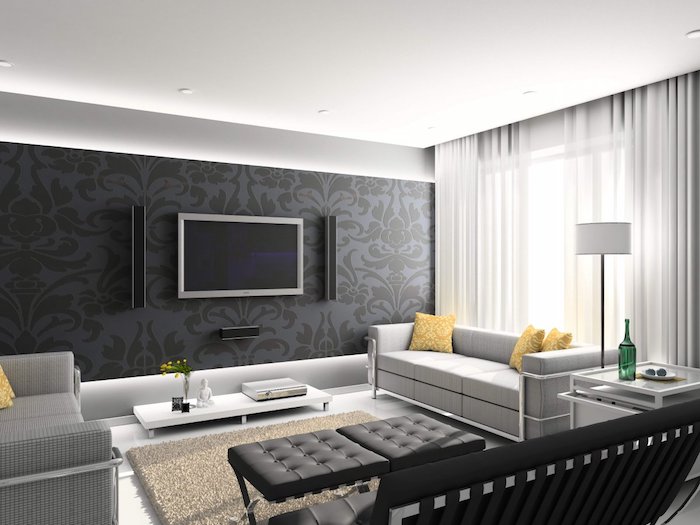 mur couleur gris anthracite, tapis et canapés gris, meuble tv minimaliste blanc, rideaux blancs, ambiance zen dans un salon moderne