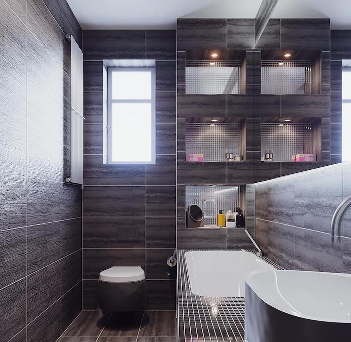 amenagement de petite salle de bain en longueur, carrelage gris foncé, rangement niche murale, baignoire à poser miniature