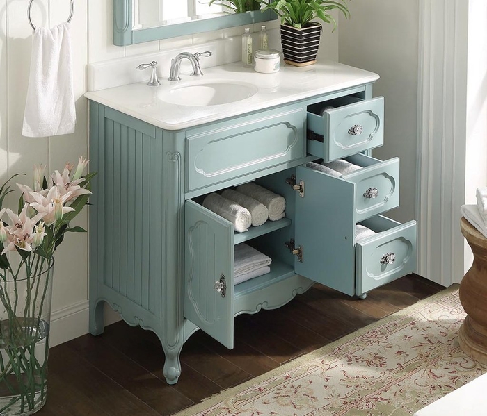 commode salle de bain repeinte en bleu pastel et transformée meuble sous lavabo fonctionnel et esthétique