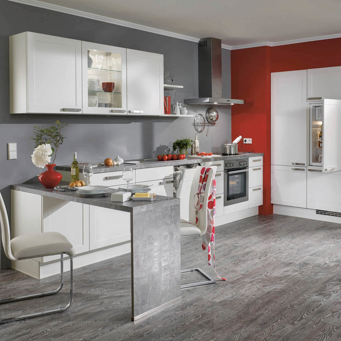 cuisine grise et rouge au design contemporain où le gris s invite sur les murs, le carrelage et coin repas intégré d aspect béton