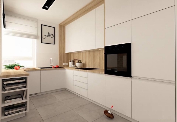 décoration minimaliste dans une cuisine moderne équipée de meubles blancs à ouverture automatique avec un pan de mur en bois clair