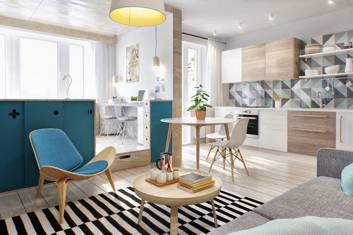 idée déco studio avec muret bleu et cube multifonction, petite cuisine aménagée en longueur avec meubles blanc et bois