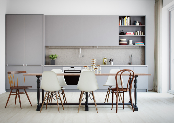 une cuisine gris clair minimaliste et discrète, aménagée en longueur et ouverte sur la salle à manger